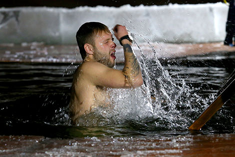 Belarusian Orthodox believers take ice plunges for Epiphany