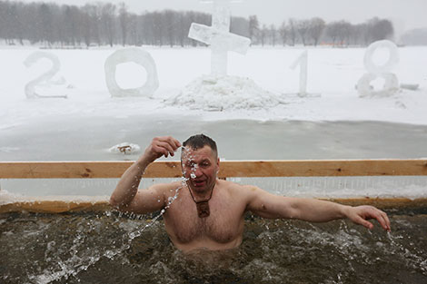 Belarusian Orthodox believers take ice plunges for Epiphany on Komsomolskoye Lake in Minsk