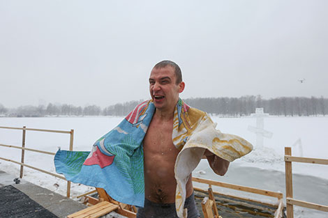 Belarusian Orthodox believers take ice plunges for Epiphany on Komsomolskoye Lake in Minsk