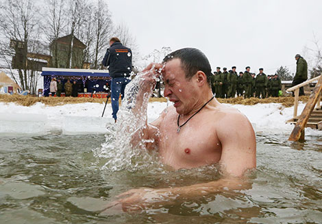 Soldiers of Special Operations Forces take ice plunges for Epiphany