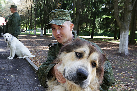 Private Aleksei Kantsov and Caucasian Shepherd Imperia