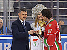 Sports and Tourism Minister Sergei Kovalchuk presents award to Belarus President Team Player of the Game Daniel Corso