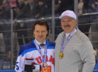 Alexander Lukashenko awards Toni Makiaho (Finland), the best forward of the Christmas tournament