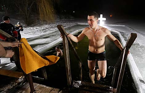 Belarusian dive into ice waters to celebrate Epiphany