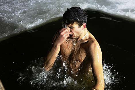 Belarusian dive into ice waters to celebrate Epiphany