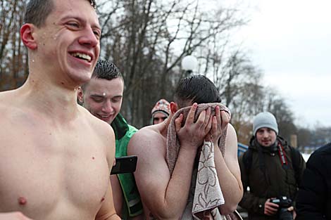 Belarusian dive into ice waters to celebrate Epiphany