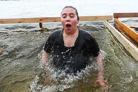 Belarusian dive into ice waters to celebrate Epiphany