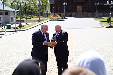 Belarus President Aleksandr Lukashenko and Russian Ambassador to Belarus Dmitry Mezentsev 