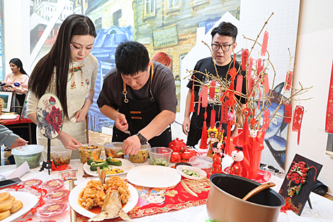 Participants of the Grace International beauty contest demonstrate cooking skills 