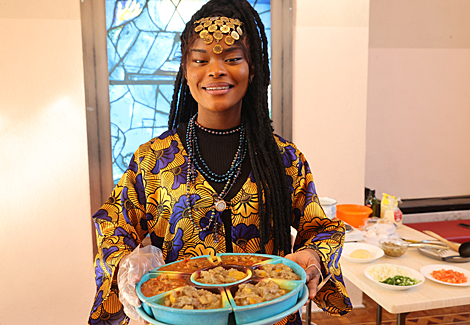 Participants of the Grace International beauty contest demonstrate cooking skills 