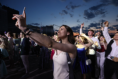 University graduates celebrate outside Palace of Sports 