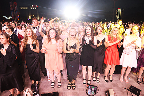 University graduates celebrate outside Palace of Sports 