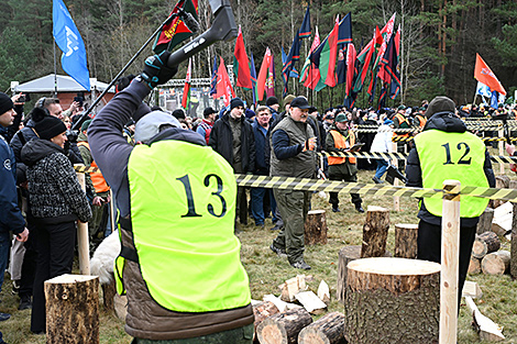 Lukashenko goes to firewood chopping championship for reporters