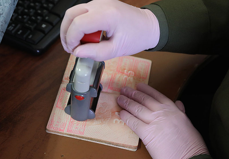 Stamping passport at the border