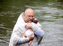 The rite of baptism in the waters of the Neman River in Novogrudok District